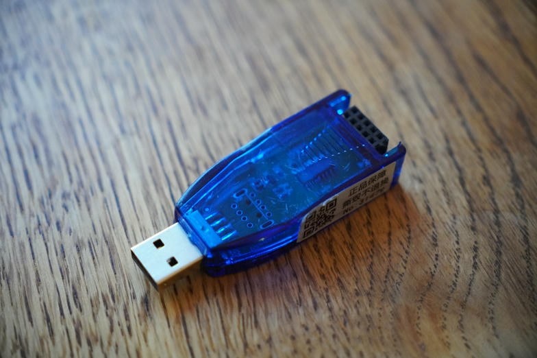 Close-up of the blue USB programmer dongle