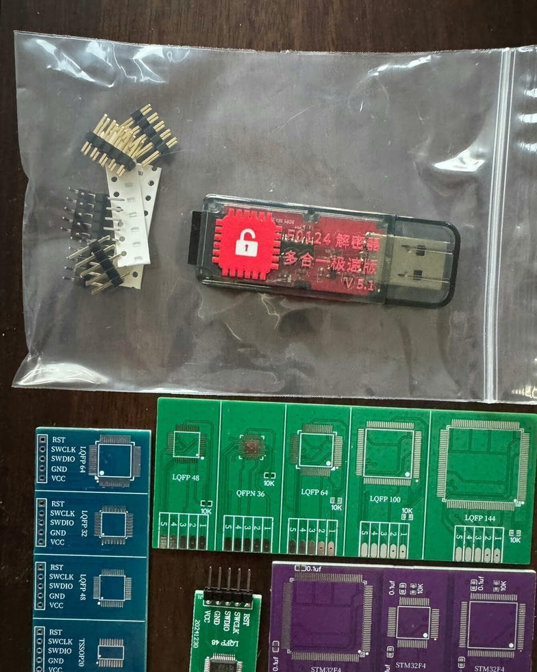 Xianyu listing photo showing the decryptor kit with USB dongle, multiple adapter PCBs and SWD pinout reference cards